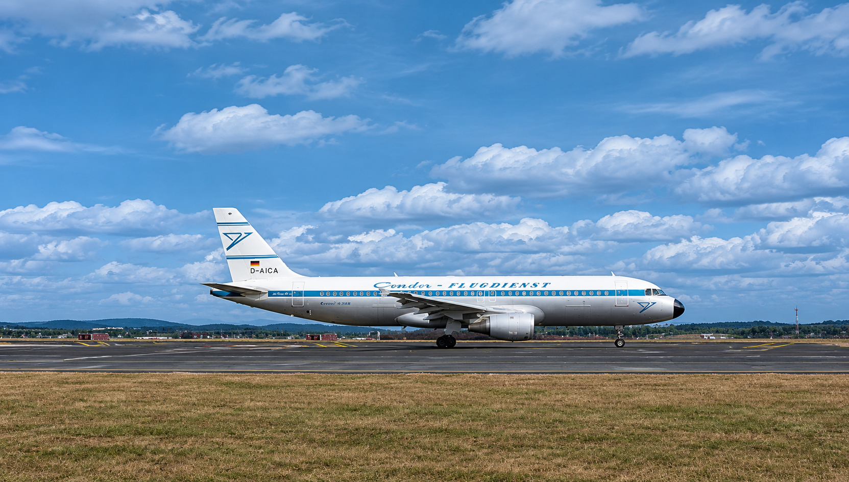 Passenger airplane shown from the side in a historic special livery on an airport runway.